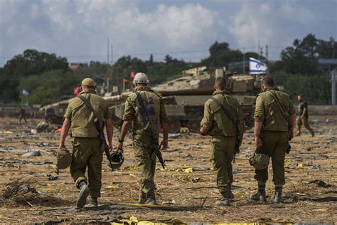 Gaza awaits aid from Egypt as Israel readies troops for ground assault
